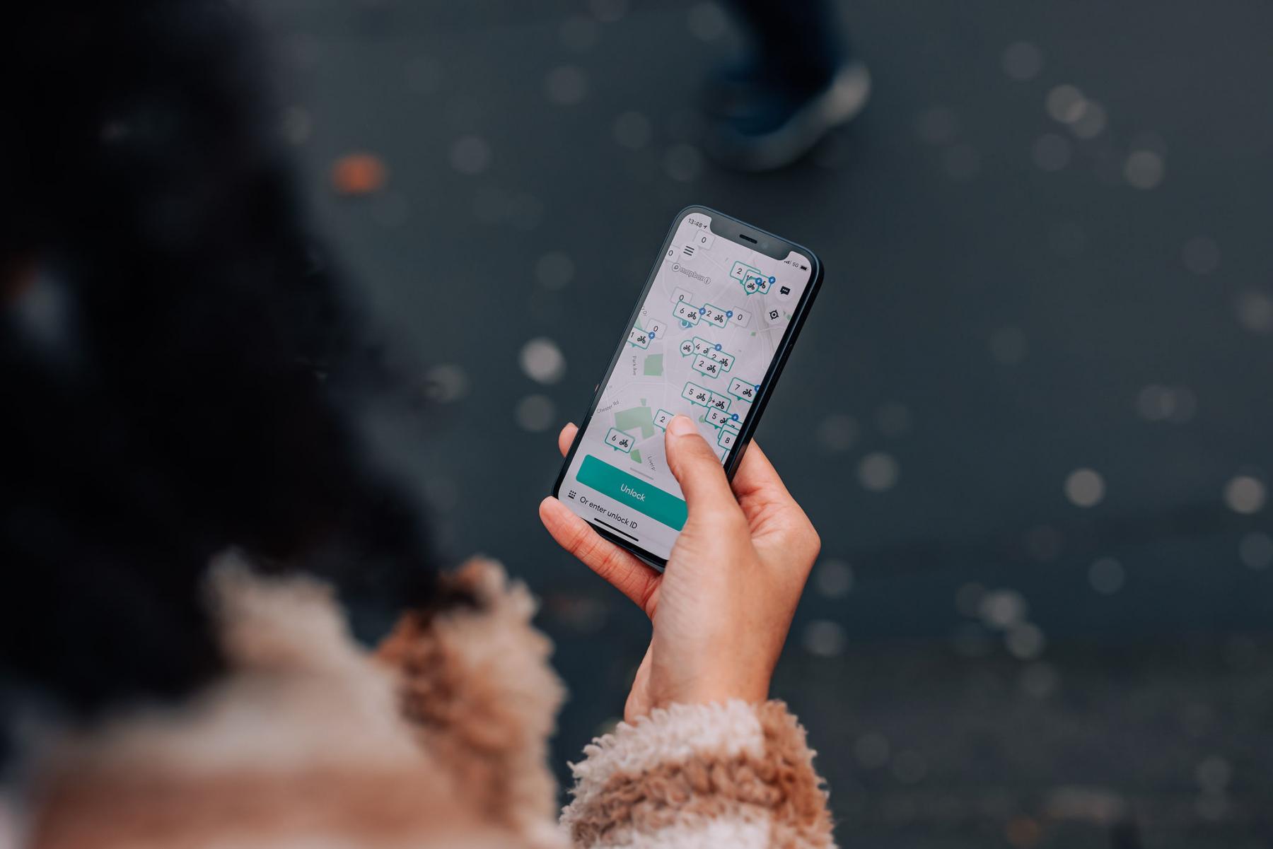 A woman using the Beryl bike app