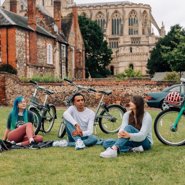 Beryl riders and bikes in front of Norwich Cathedral