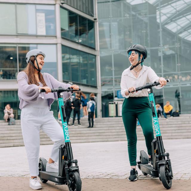 Two scooters with young people