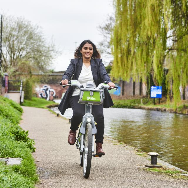 Woman riding West Midlands Cycle Hire bike