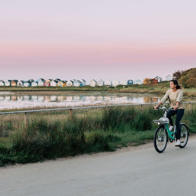 Rider enjoying a Beryl bike journey along the Bournemouth seafront 