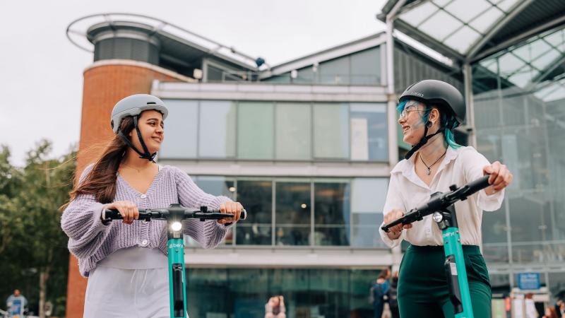 women riding Beryl e-scooters in Norwich