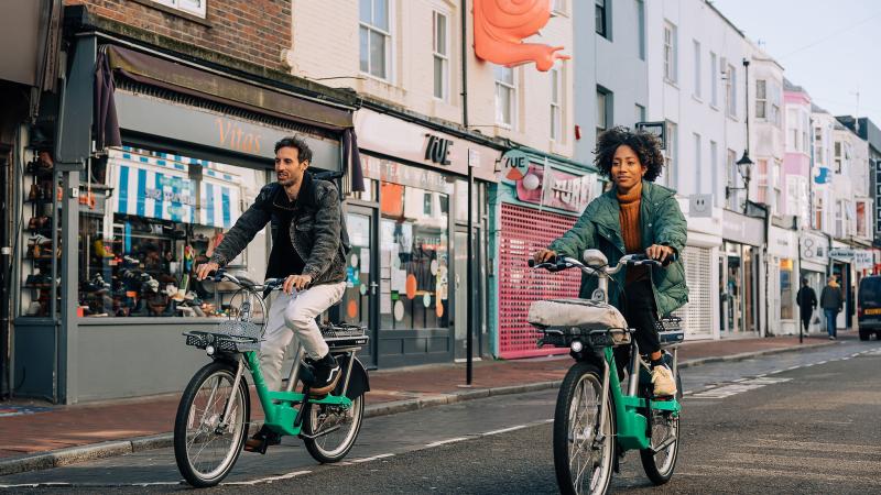 man and woman riding Beryl BTN e-bikes in Brighton