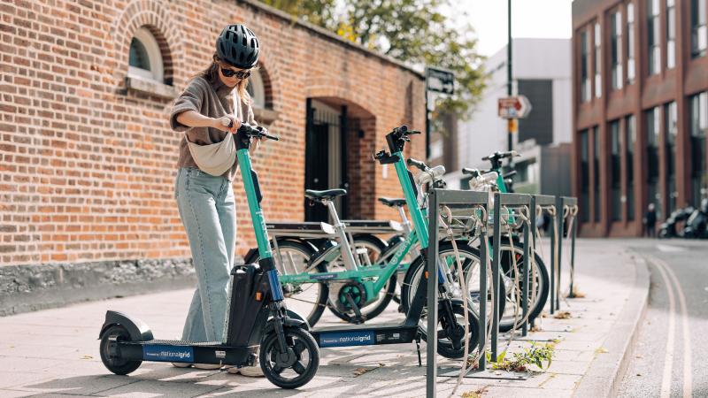 Beryl rider in Norwich about to end or start an e-scooter journey by some office buildings